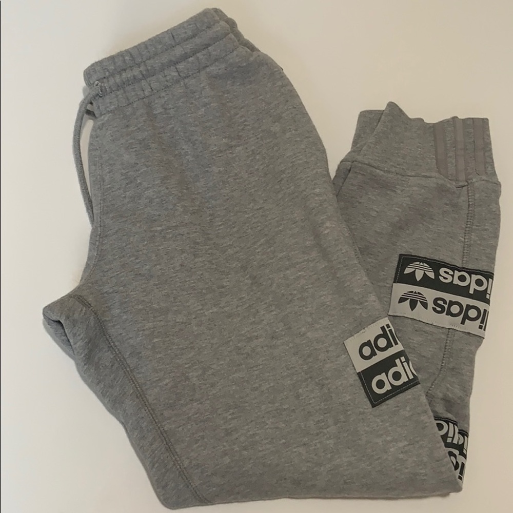 Light grey adidas sweatpants w/ logos on each side